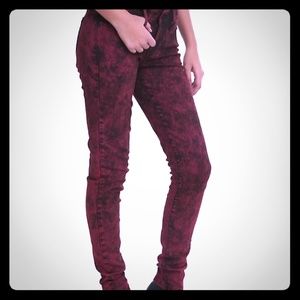 Red and black acid wash skinny jeans